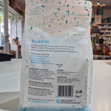 Back view of a Soakin packaging with text and branding details.