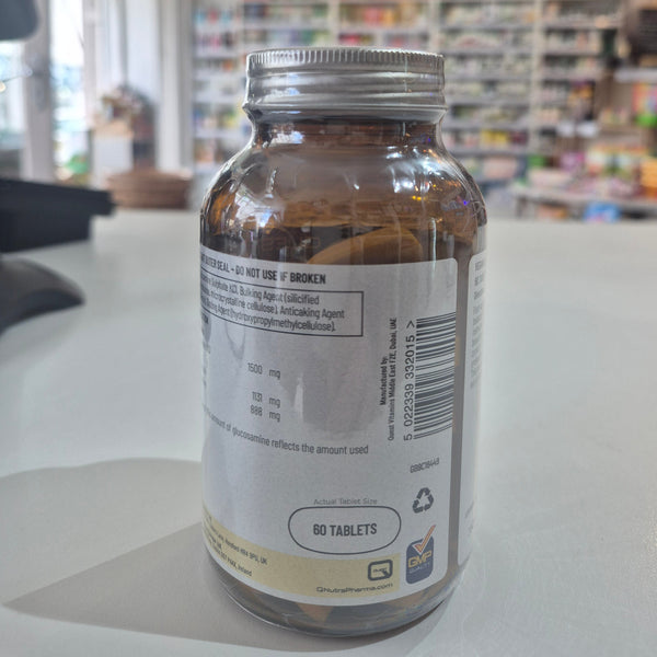 Bottle of supplements on a shelf with a blurred store background